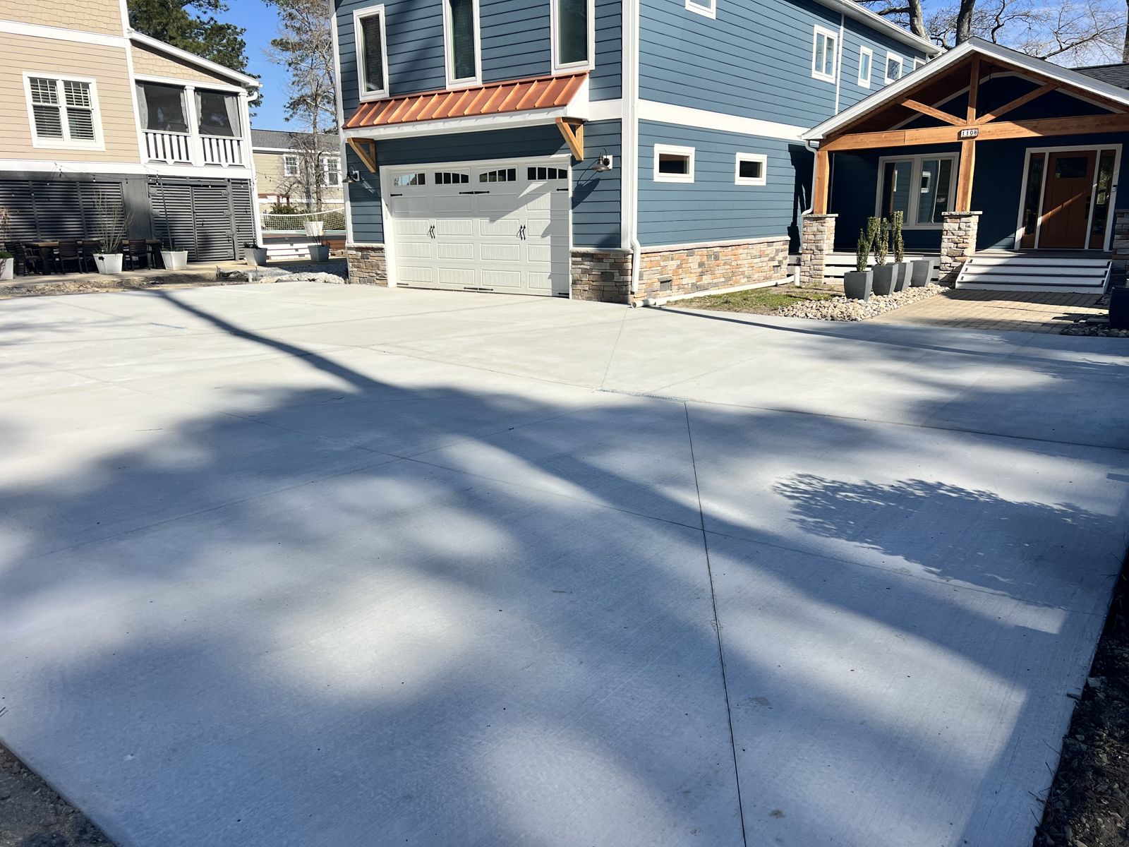 Concrete driveway with integrated trench drain at the garage