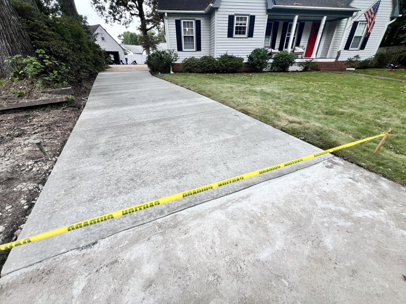 Newly replaced concrete driveway at a classic Hampton Roads home