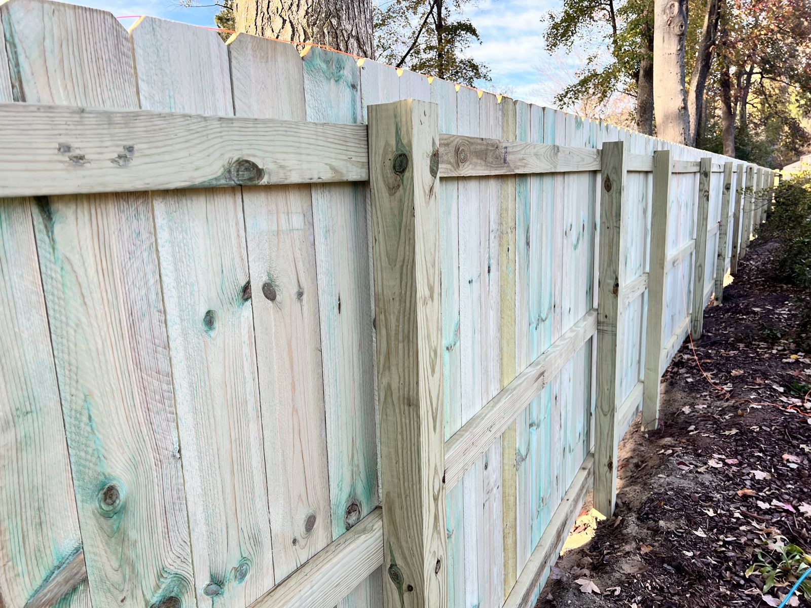 Fence framing showing posts and triple rails during construction